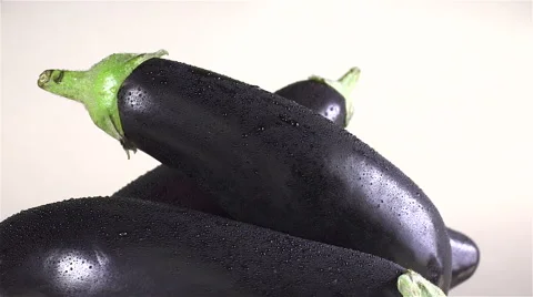 Eggplant isolated rotating on beige background Video stock 62369227