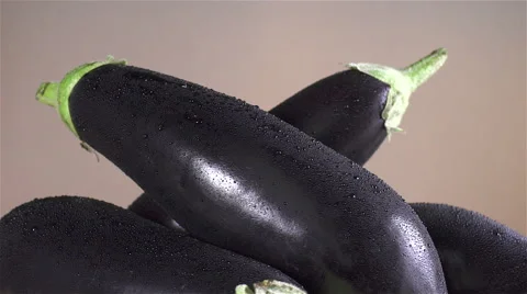 Eggplant isolated rotating on brown background Stock Footage 62368029