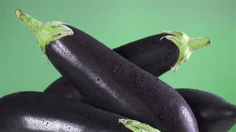 Eggplant isolated rotating on green background Stock Footage 62368450