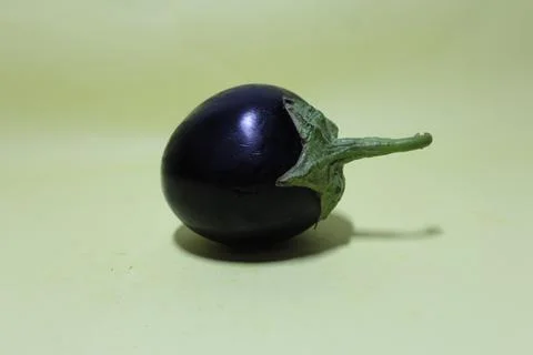 Eggplant on a light green background Stock Photos