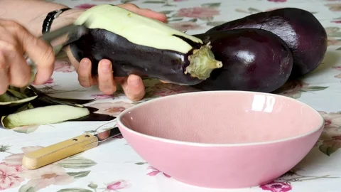 An eggplant is peeled in a kitchen. Stock Footage 94962085