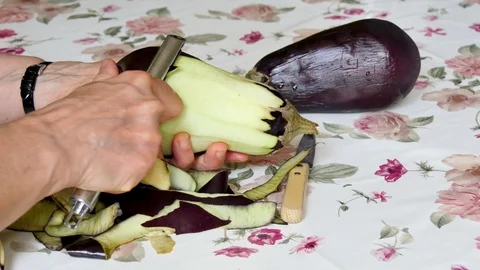 An eggplant is peeled in a kitchen. Stock Footage 94962982