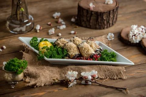 Eggplant roulets on the table Stock Photos