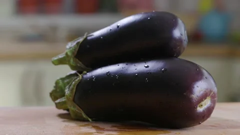 Eggplant On the Table In Kitchen In House Video stock 157994410