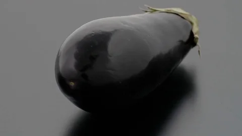 Eggplant on Turntable - Black Background Stock Footage 75704894