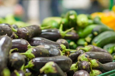 Eggplants in boxes in supermarket Stock Photos