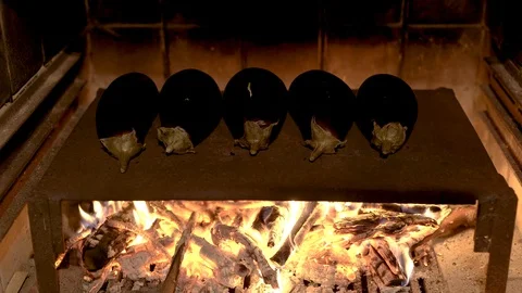 Eggplants grilling on a hotplate Stock Footage 85938149