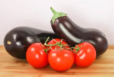 Eggplants with tomato Stock Photos