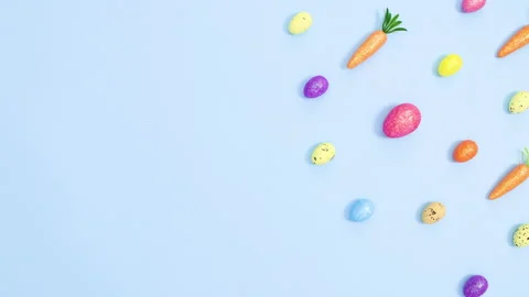 Eggs and carrots make creative vibrant Easter pattern. Stop motion Stock Footage 149932481