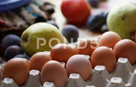Eggs and fruits Stock Photos