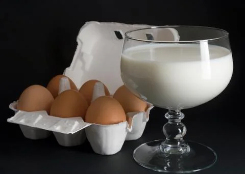 Eggs and milk Stock Photos