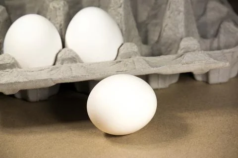 Eggs and package Stock Photos