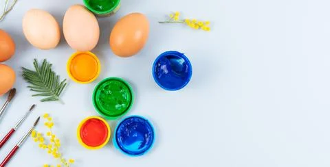 Eggs and paints. Easter eggs decoration process. Stock Photos