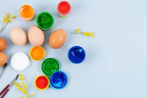 Eggs and paints. Easter eggs decoration process. Stock Photos