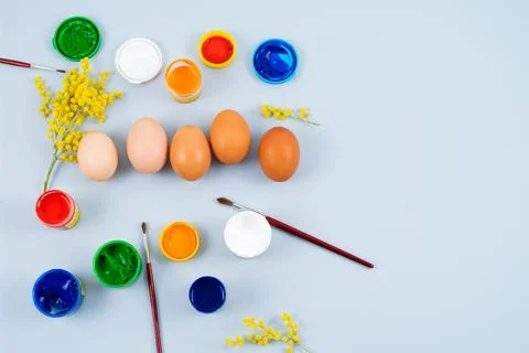 Eggs and paints. Easter eggs decoration process. Stock Photos