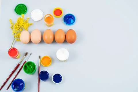 Eggs and paints. Easter eggs decoration process. Stock Photos
