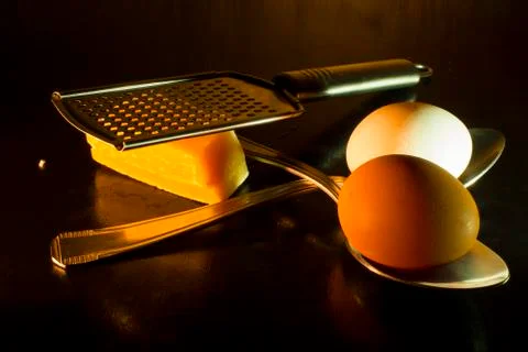 Eggs and parmesan Stock Photos