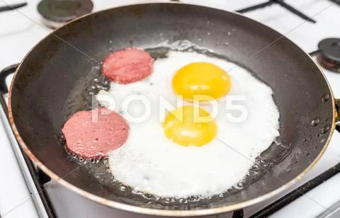 Eggs And Sausage On Frying Pan