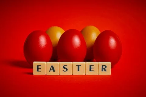Eggs and text on a red background Stock Photos