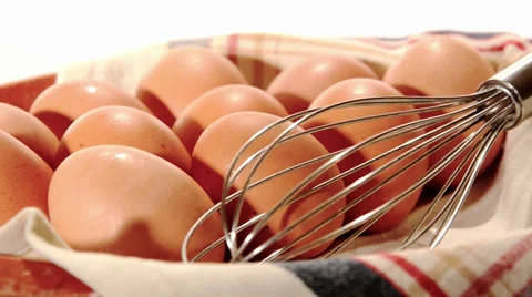 Eggs and whisk Stock Footage 32326395