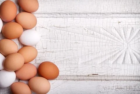 Eggs on a antique panel Stock Photos