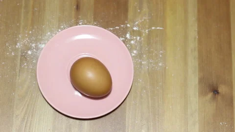Eggs appear and move on the plate Stock Footage 143001052