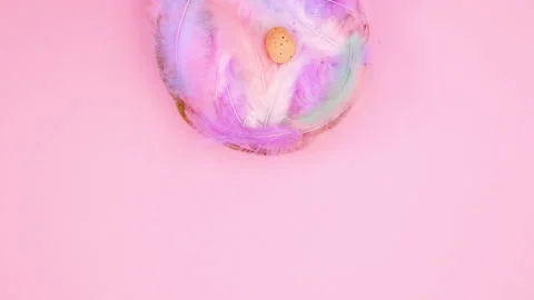 Eggs appear in basket with feathers and Happy Easter text write. Stop motion Stock Footage 148198147