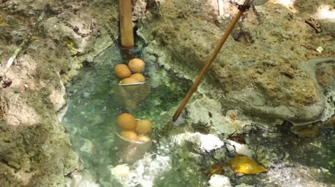 Eggs that are boiled in a hot volcanic spring Stock Footage 40447935