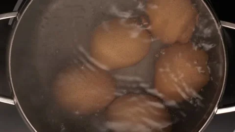 Eggs are boiled in a pan, top view Video stock 143110384