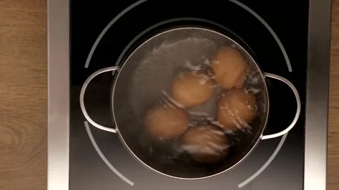 Eggs are boiled in a pan, top view Video stock 143110399
