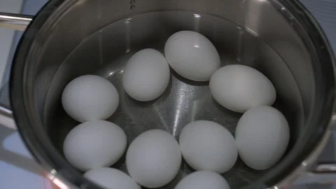 Eggs are cooked in a saucepan close up, top view Video stock 88332978