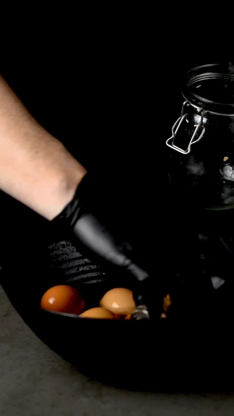 The eggs are lowered into boiling water Stock Footage 247199148