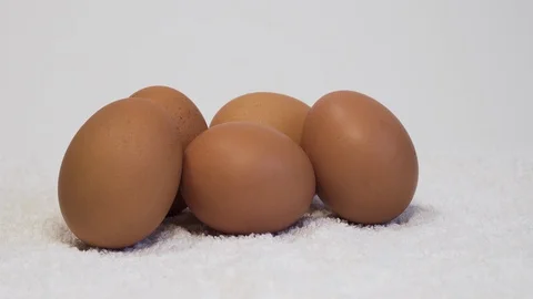 Eggs are on the white background Stock Footage 127857312