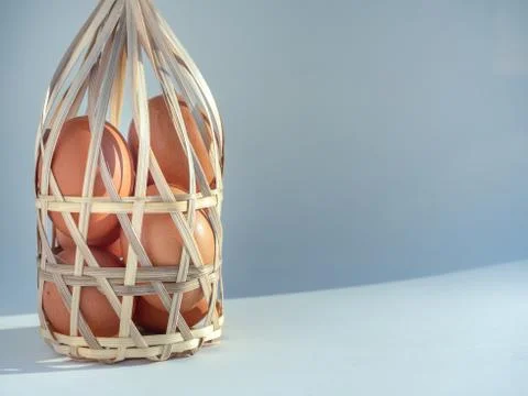 Eggs in bamboo basket. Stock Photos