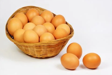 Eggs in a basket, isolated on a white background. Stock Photos