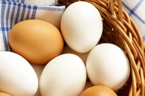 Eggs in a basket Stock Photos