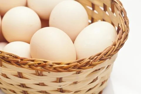 Eggs in basket Stock Photos
