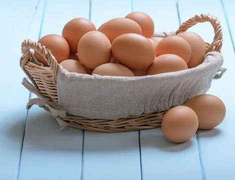 Eggs in a basket Stock Photos