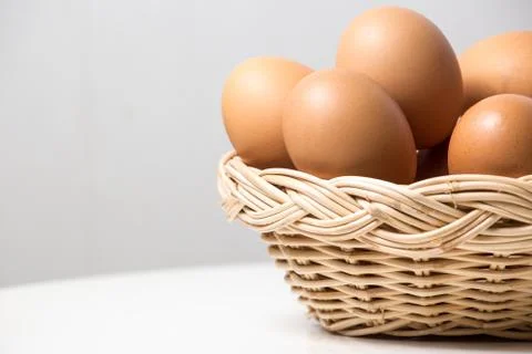 Eggs in basket Stock Photos