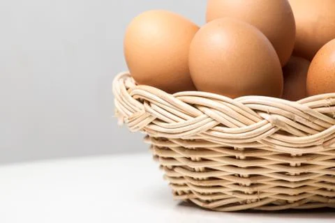Eggs in basket Stock Photos