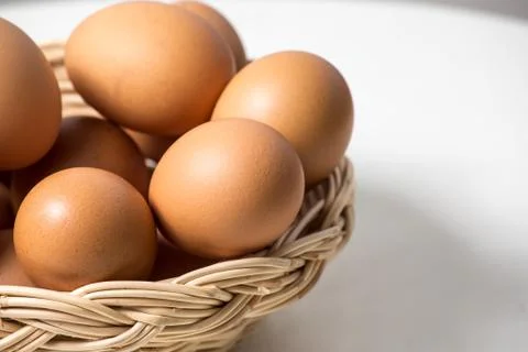 Eggs in basket Stock Photos