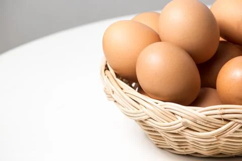 Eggs in basket Stock Photos