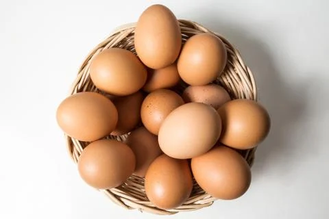 Eggs in basket Stock Photos