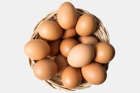 Eggs in basket Stock Photos