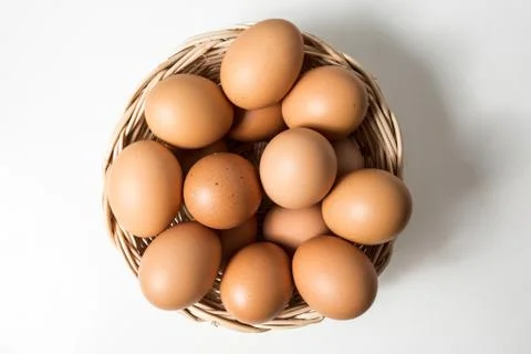 Eggs in basket Stock Photos