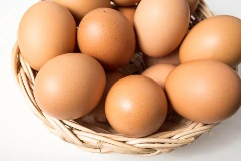 Eggs in basket Stock Photos