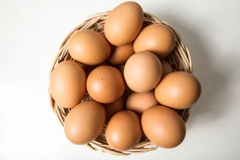 Eggs in basket Stock Photos