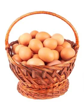 Eggs in basket Stock Photos