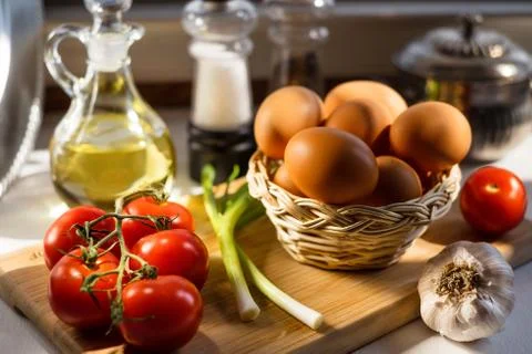 Eggs in a Basket with Vegetables Stock Photos