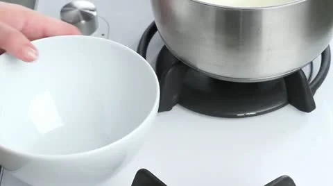 Eggs being beaten and cheese being stirred in Stock Footage 24671207